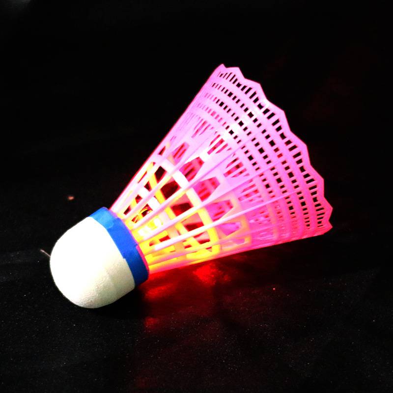 Four luminous radiant pink ball plastic feather balls in one barrel